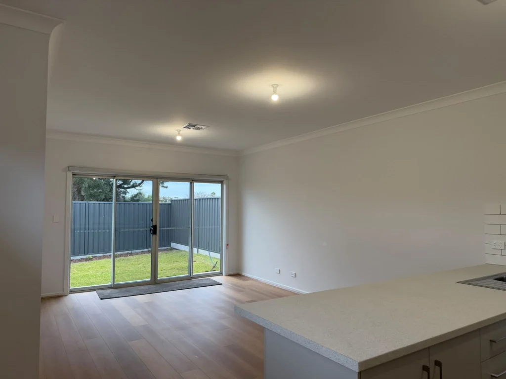 Professional interior painters applying paint to walls in an Adelaide home
